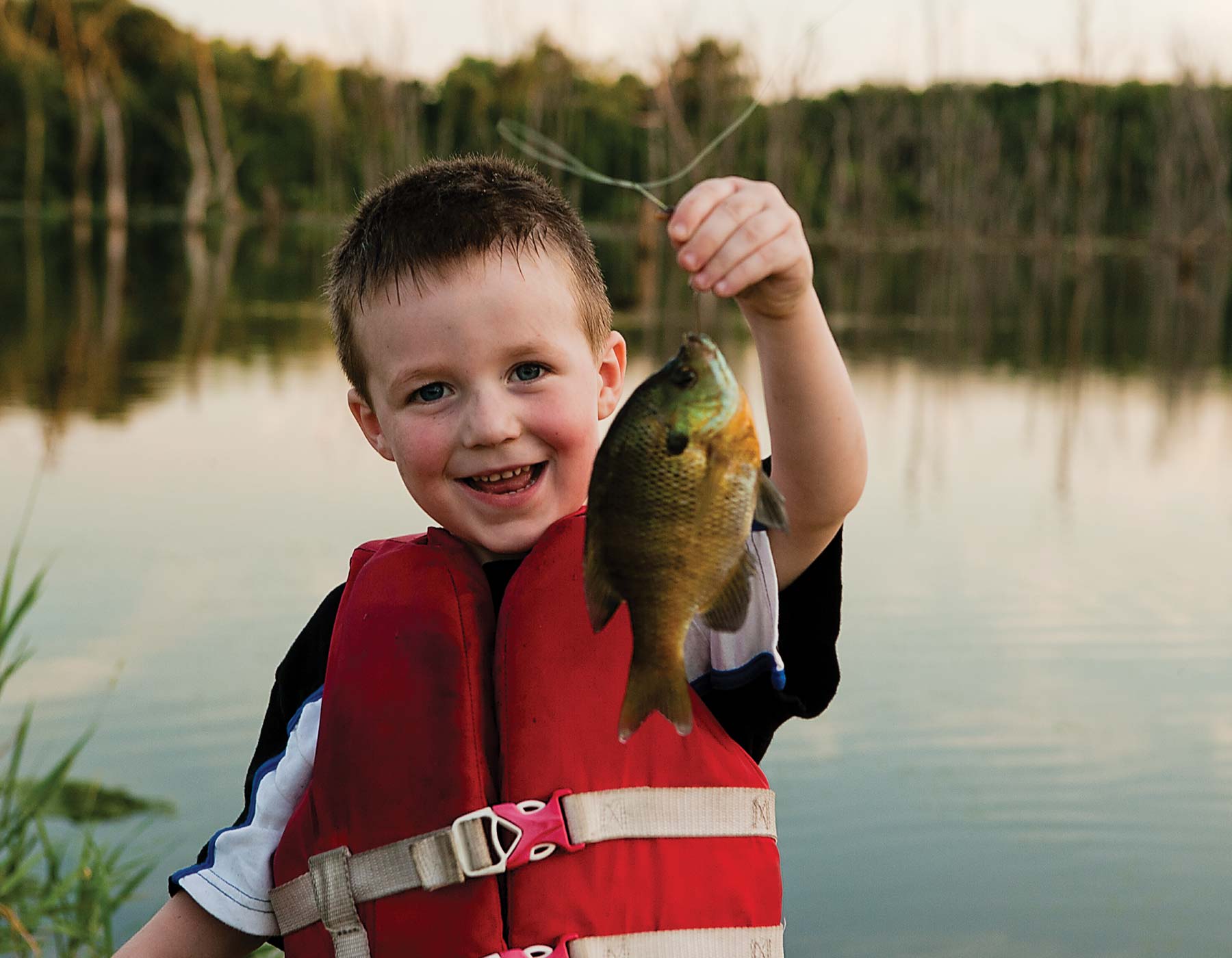 boy catching fish